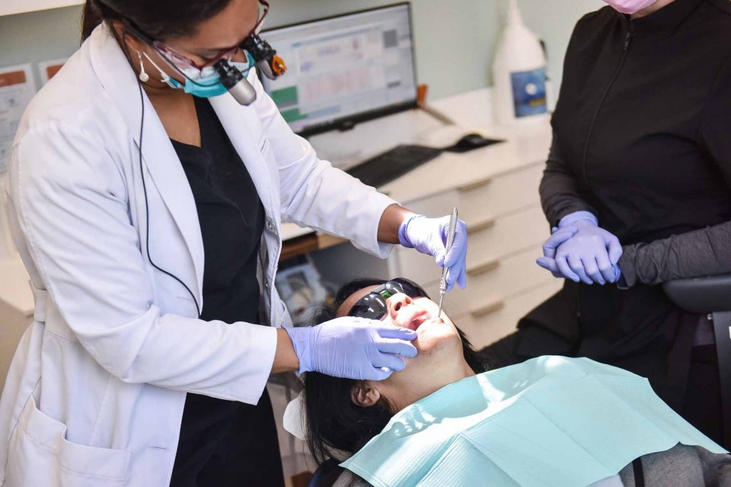 Dr. Traora Grant with Patient | River Harmony Dental | General & Family Dentist | Cochrane | Alberta