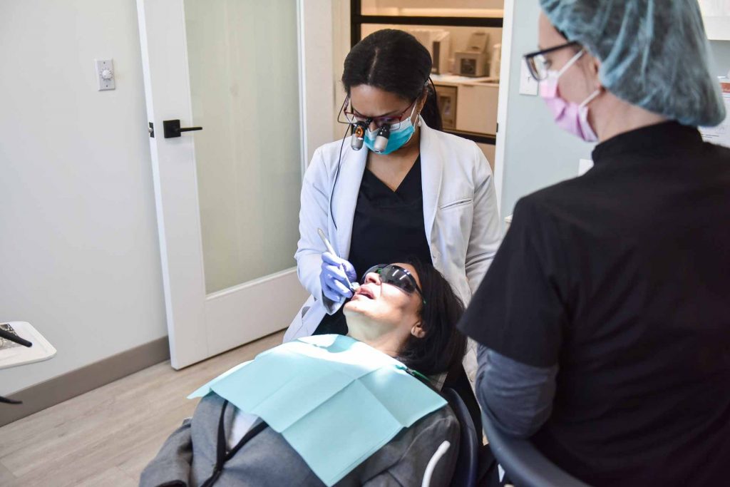 Dr. Traora Grant with Patient | River Harmony Dental | General & Family Dentist | Cochrane | Alberta