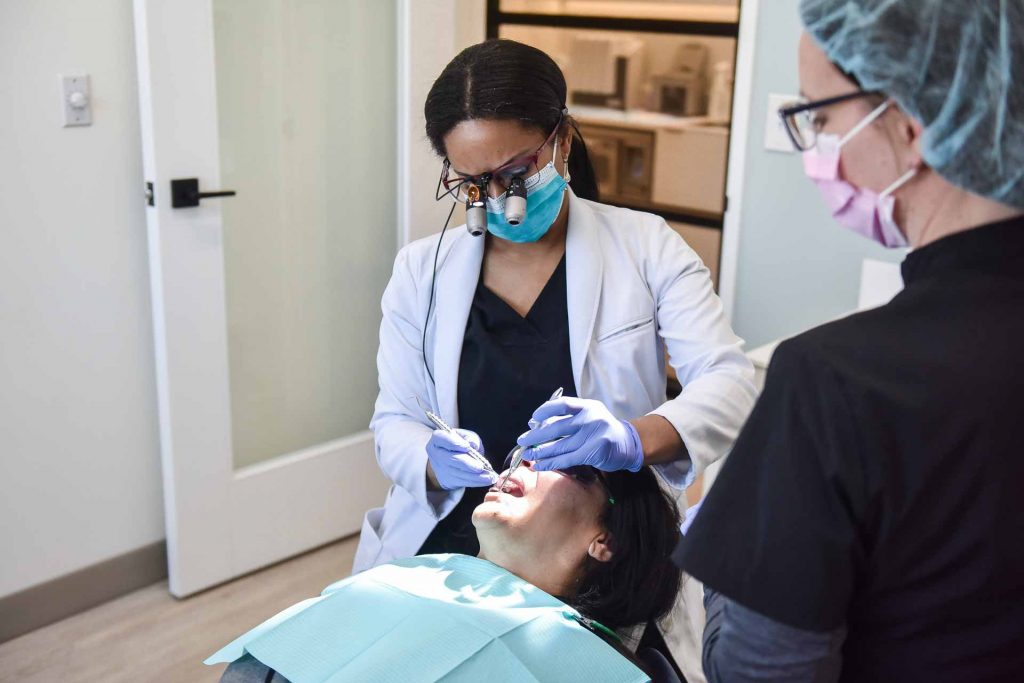 Dr. Traora Grant with Patient | River Harmony Dental | General & Family Dentist | Cochrane | Alberta